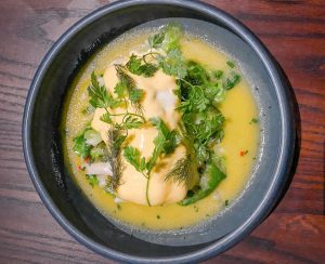 A dish of snapper and butter sauce